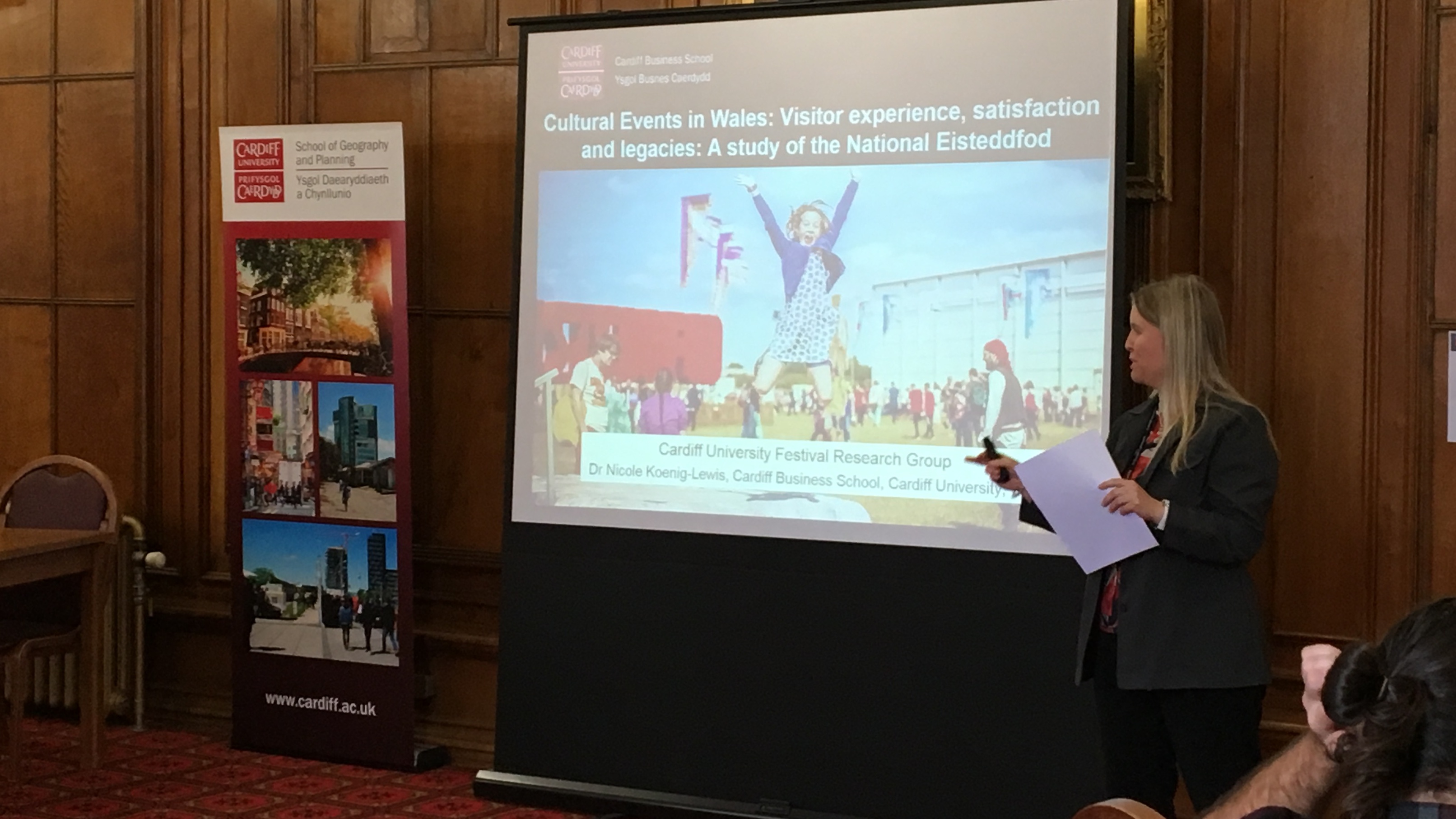 Image of female academic, Dr Nicole Koenig-Lewis, delivering powerpoint presentation