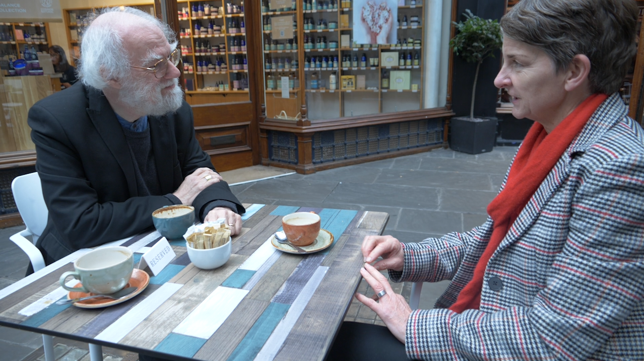 Professor Laura McAllister and Dr Rowan Williams sat outside caf&eacute;