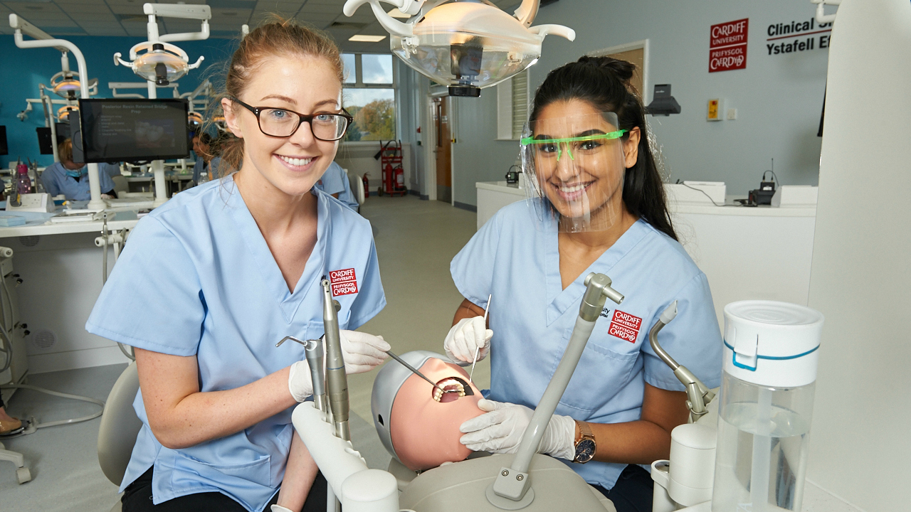 Two Dental students using facilities in dental suite 