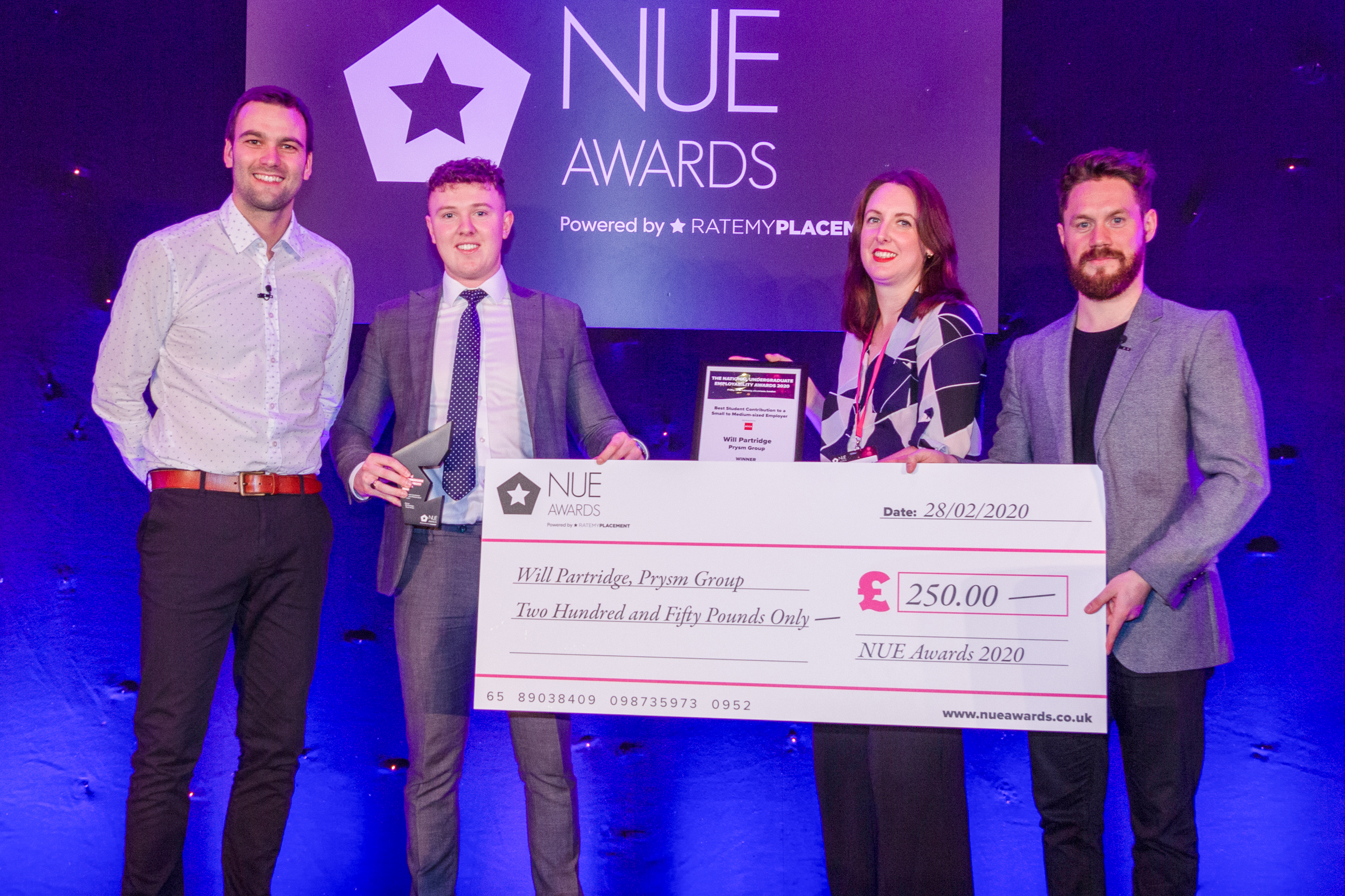 Man collects award at ceremony