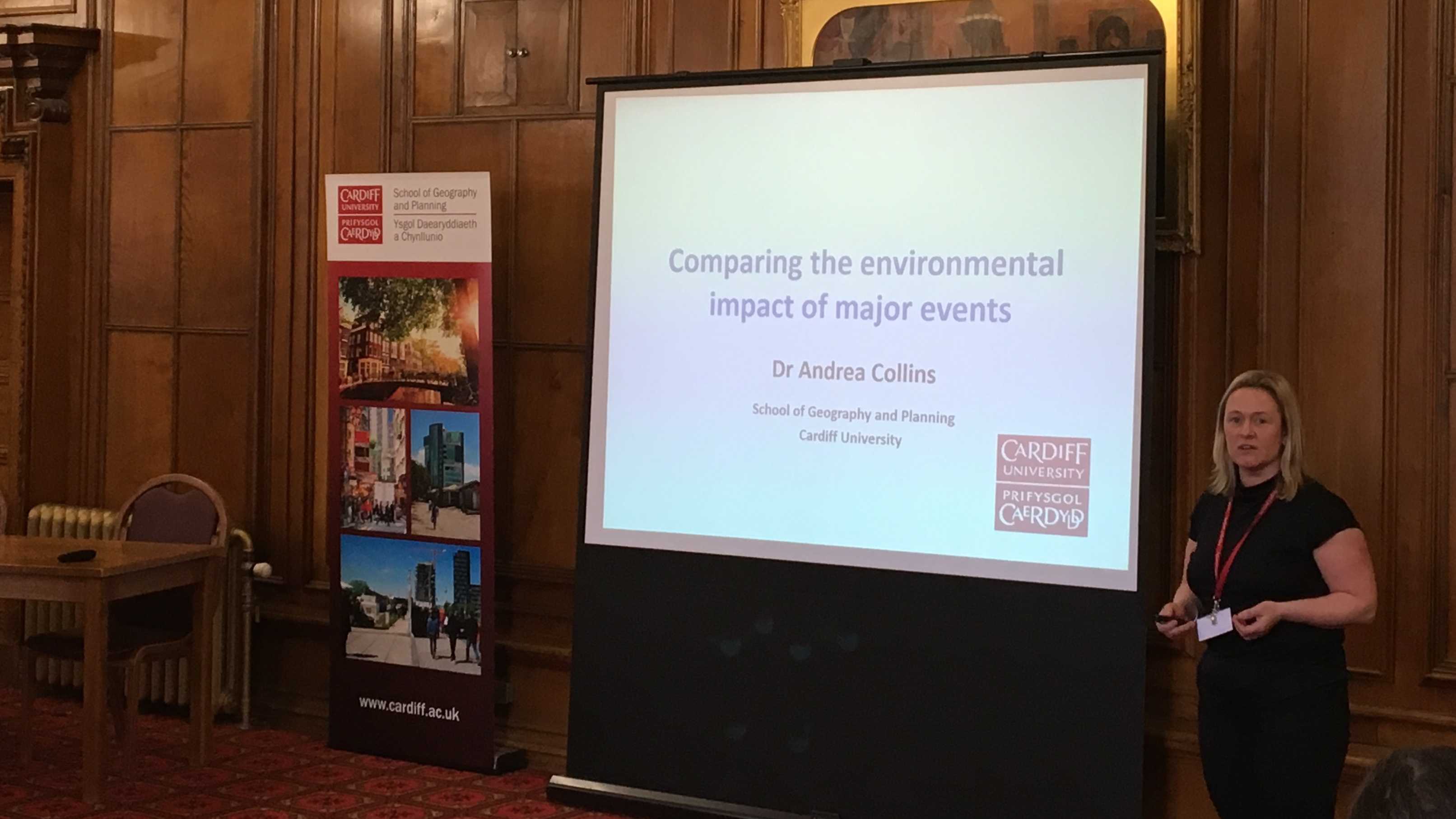 Image of female academic, Dr Andrea Collins, delivering powerpoint presentation