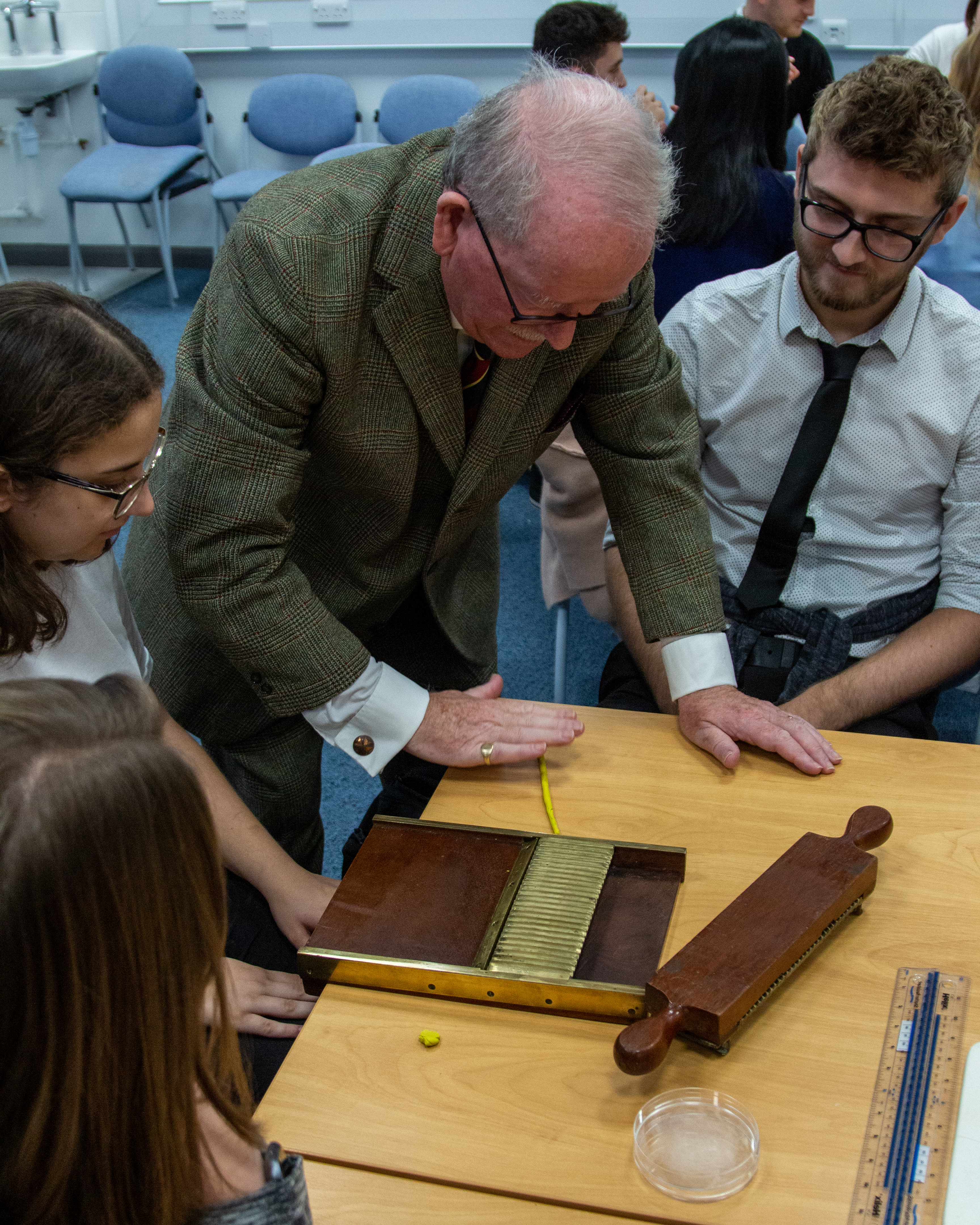 Brian Jones teaching pill rolling to the students