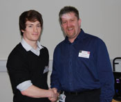 Fraser Young of The School of Dentistry shaking hands with Dr Alastair Sloan, Head of Tissue Engineering and Reparative Theme at The School of Dentistry.