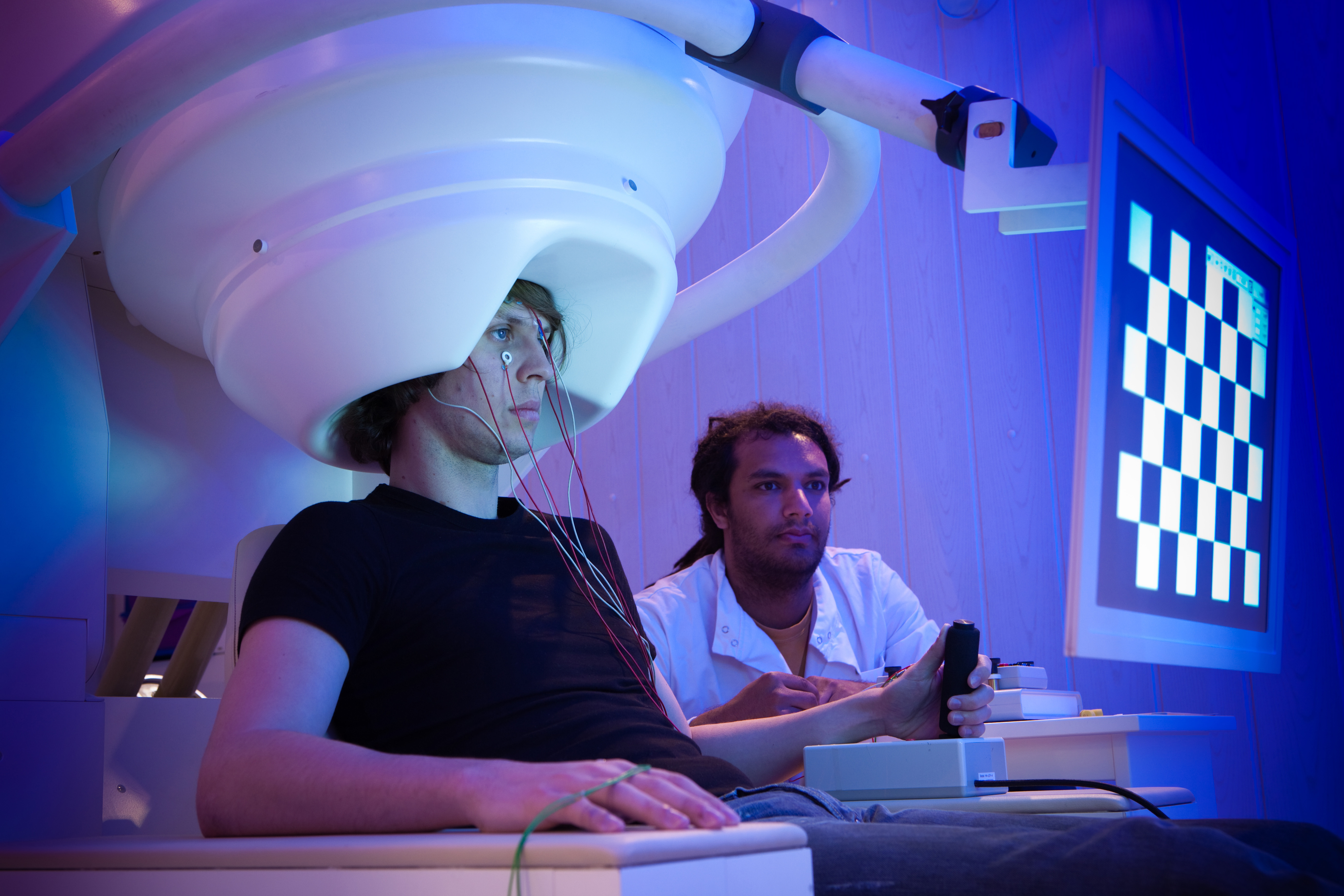 showing brain imaging equipment on patient