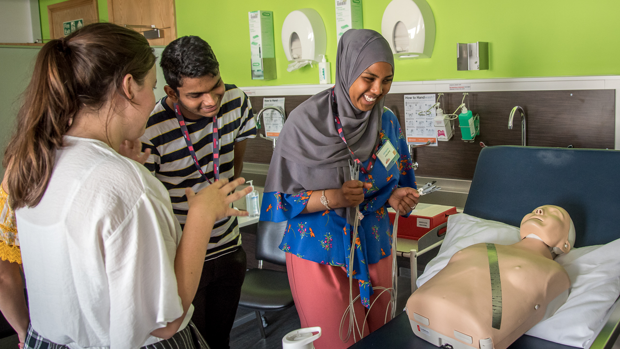 Ikram taking part in practical