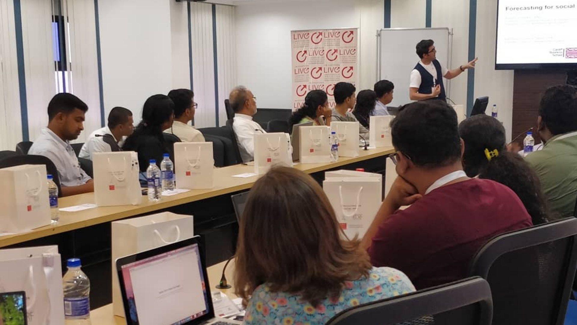 Man delivers presentation to group