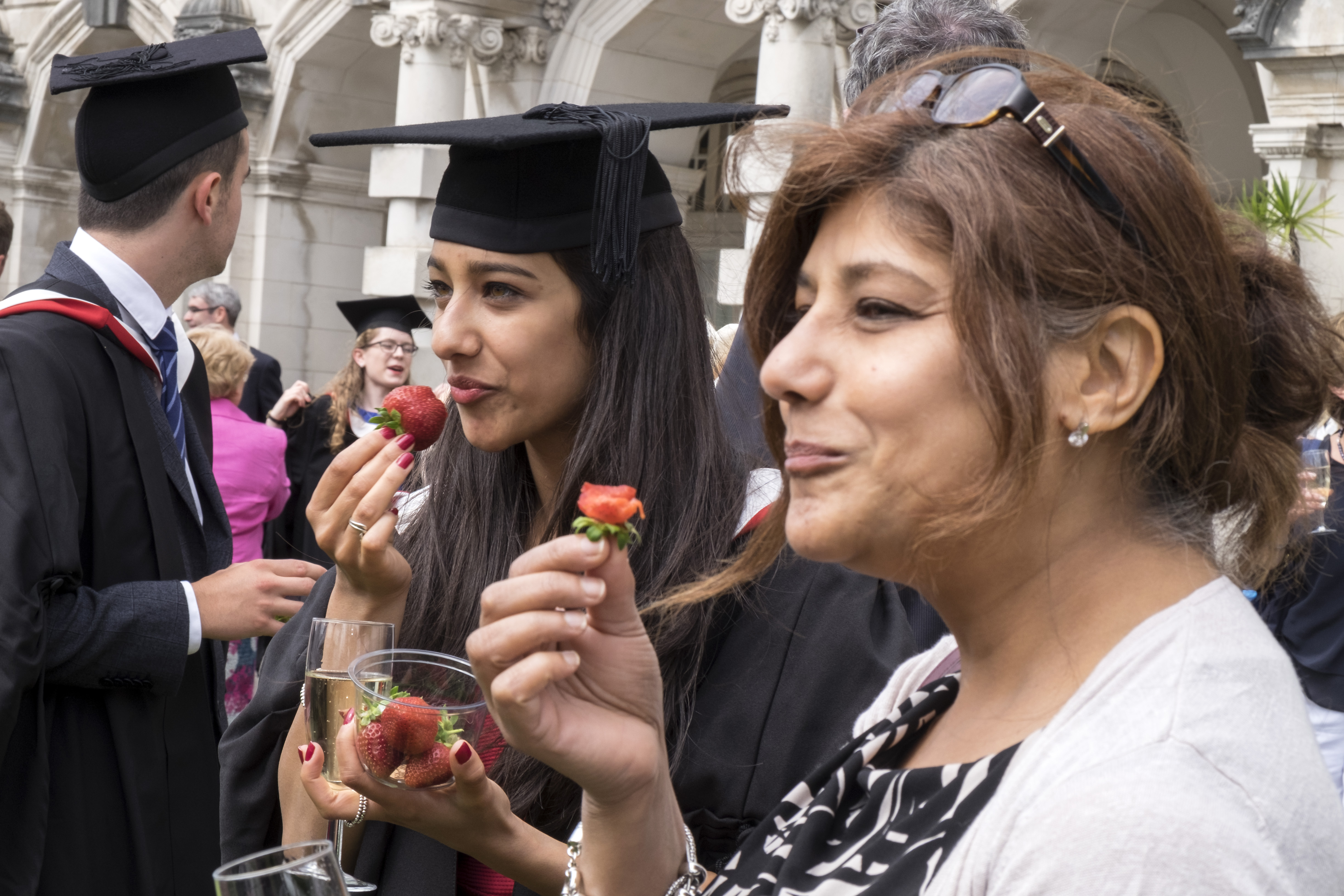 Graduation guests eating strawberries