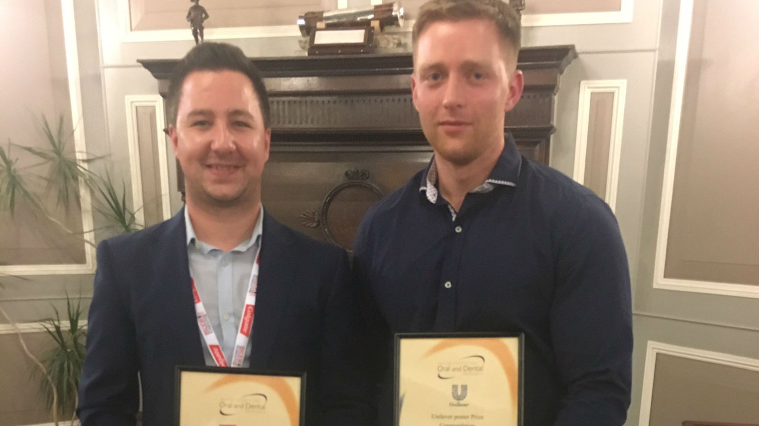 David Morse and Joshua Twigg holding their certificates and smiling