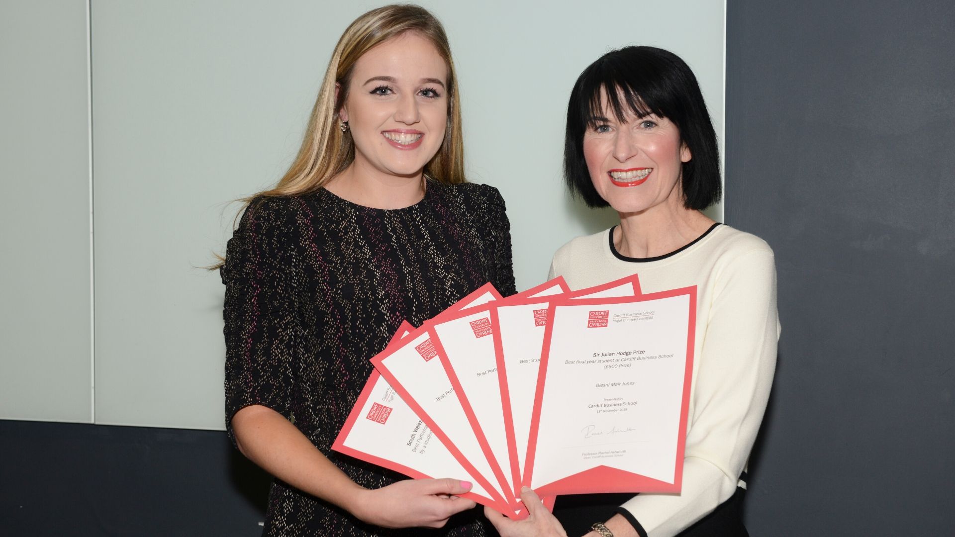 Female student collects five awards from Dean