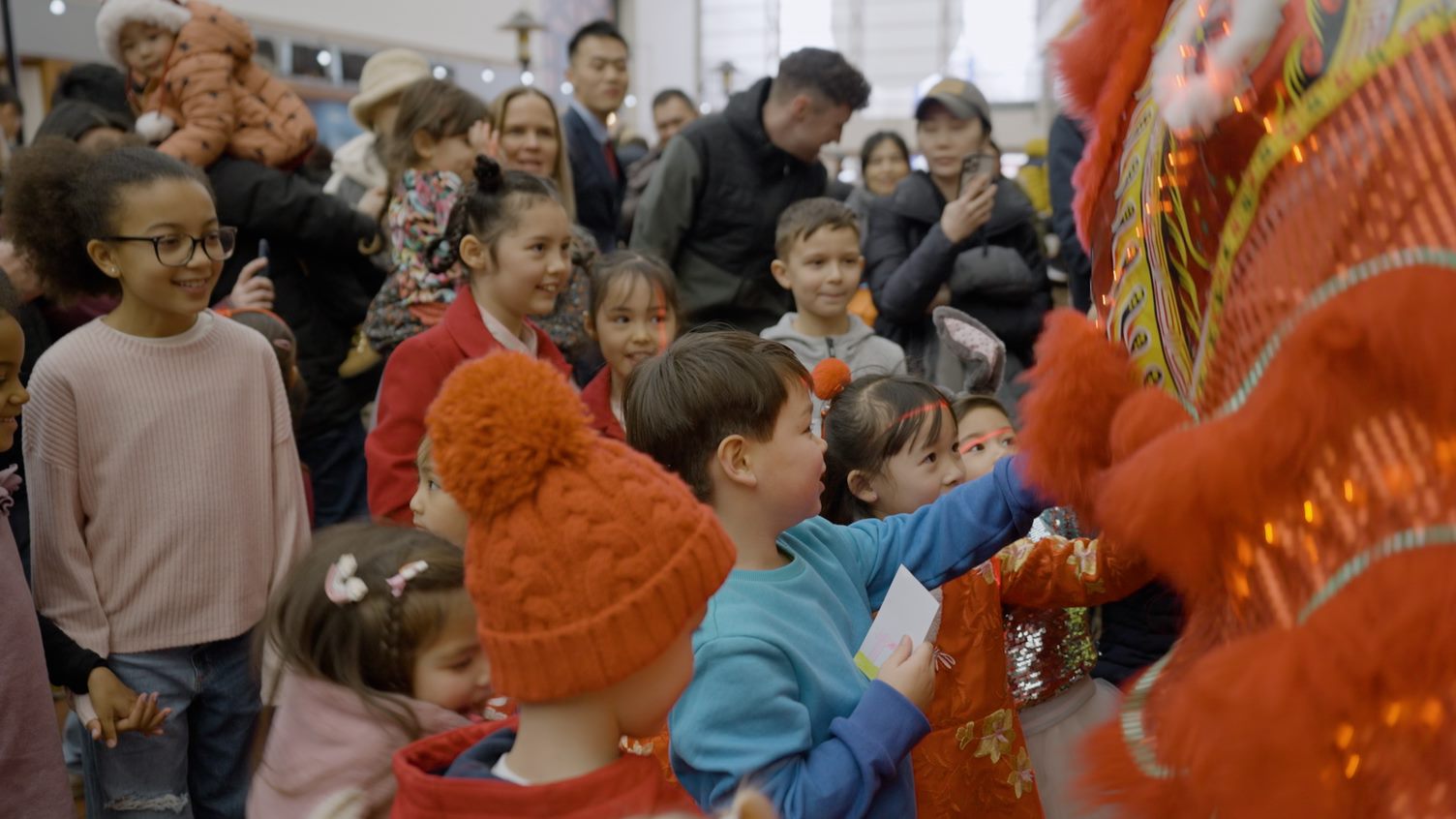 Children at the Red Dragon Centre with the Chinese dragon