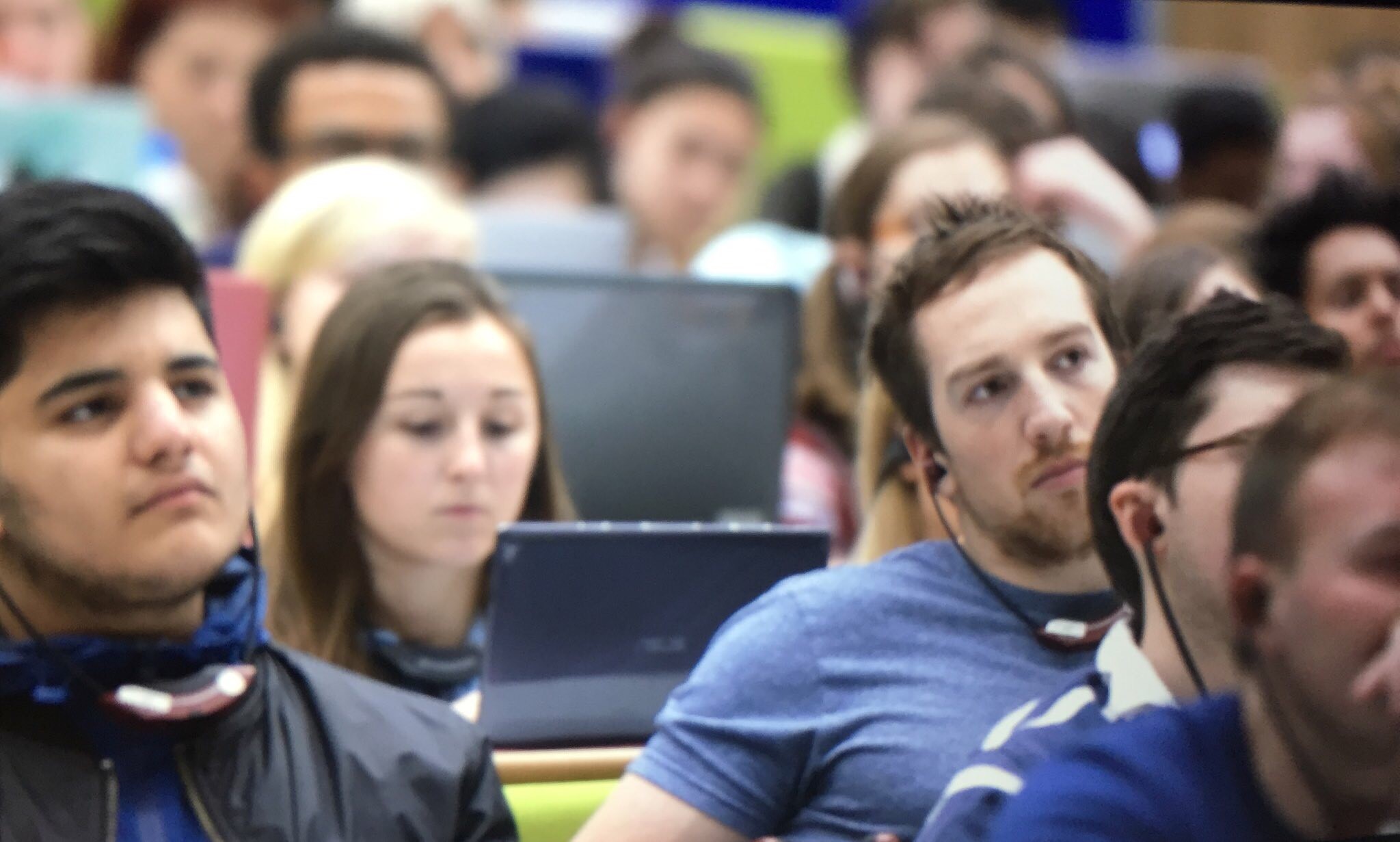 Group of students listening to translation of Welsh language lecture 