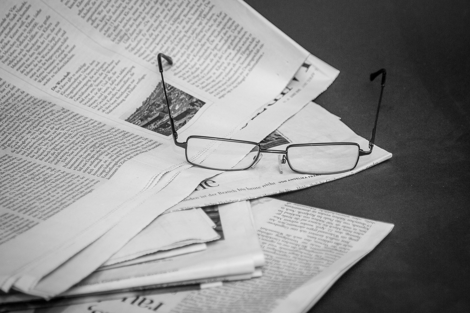 newspaper and glasses