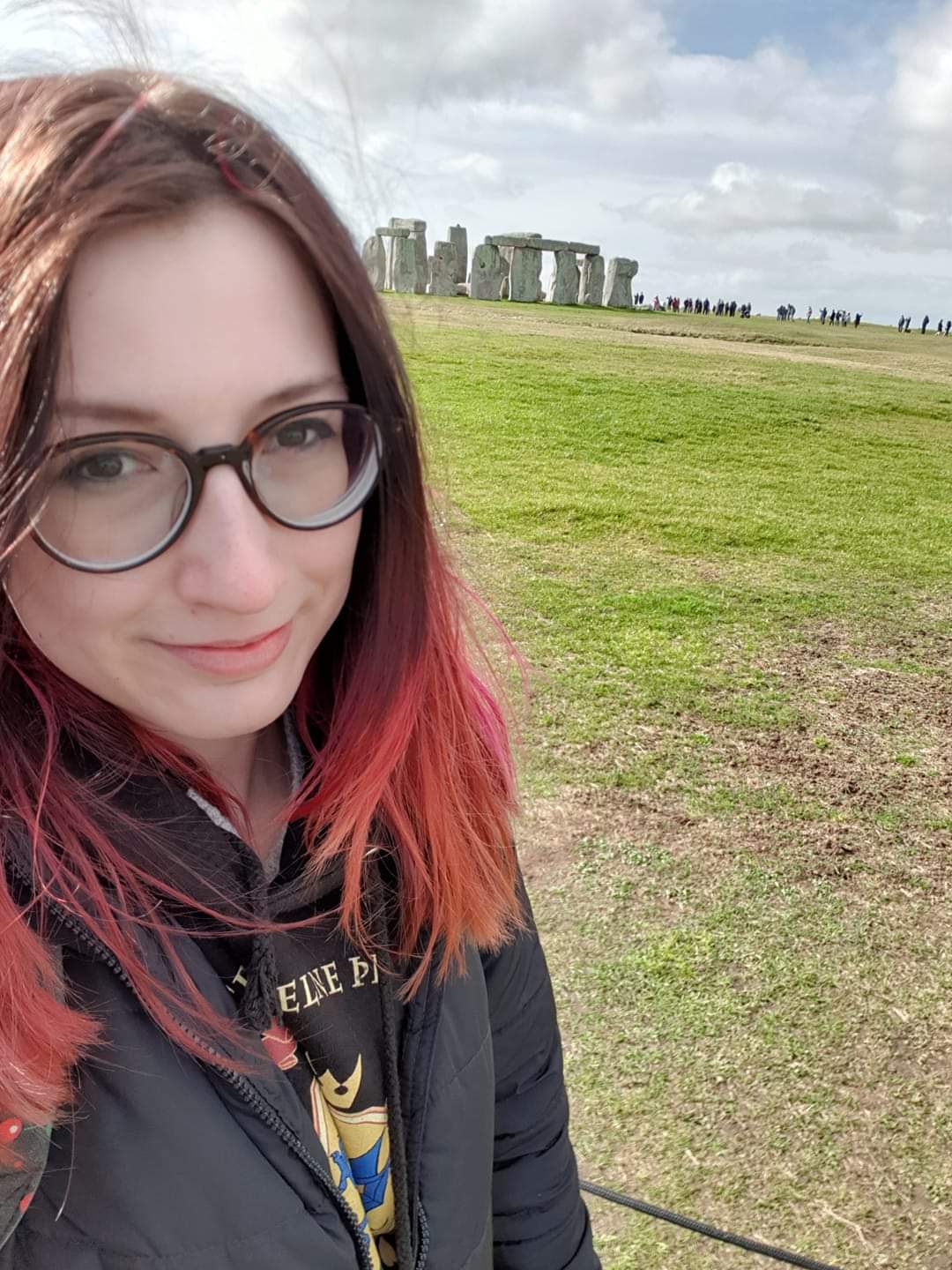 Young woman takes selfie at stonehenge