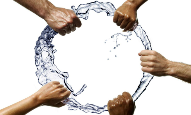 Hands holding ring of water