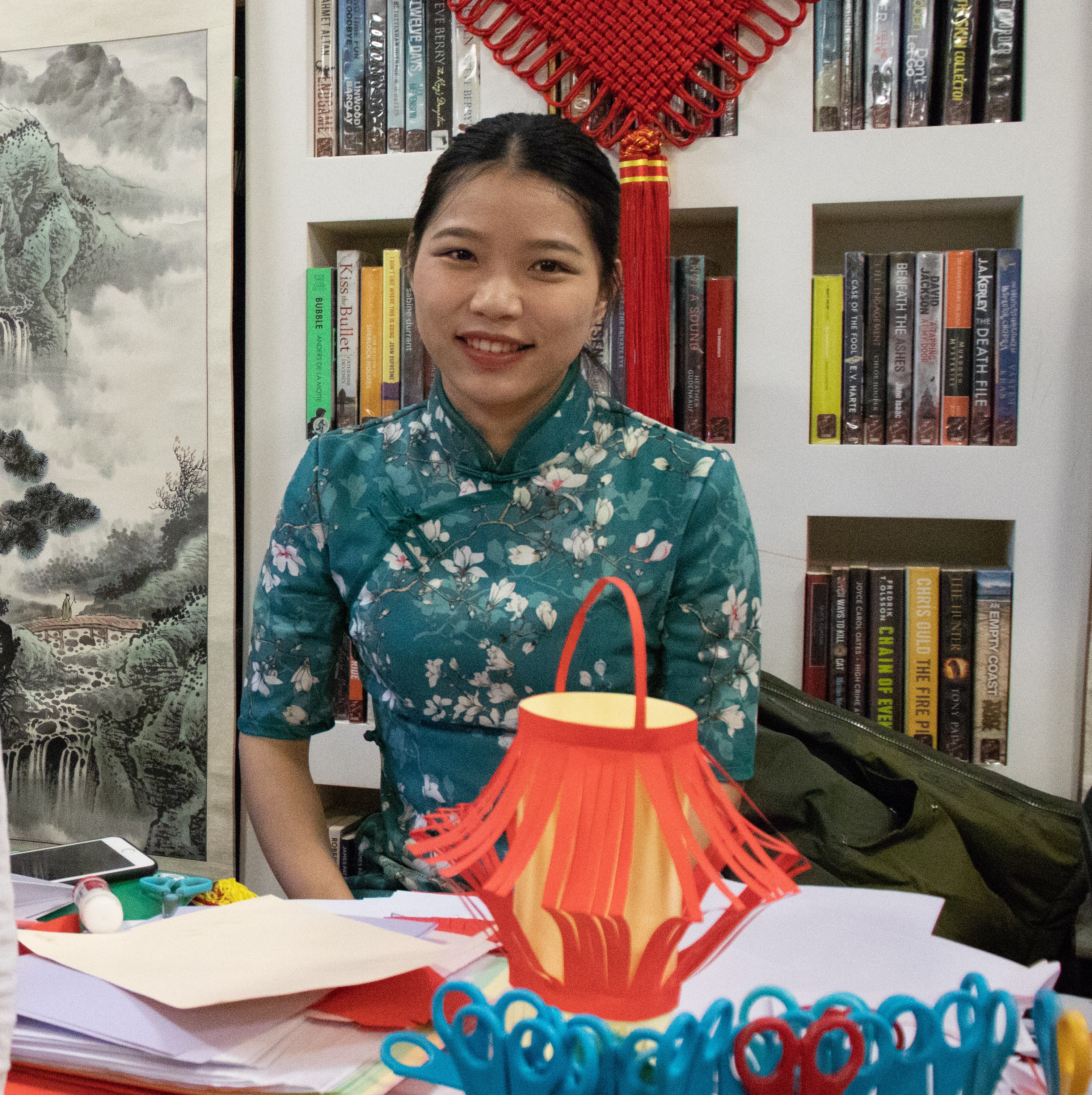 Cardiff Confucius Institute Tutor helps prepare a traditional Chinese paper-cutting activity