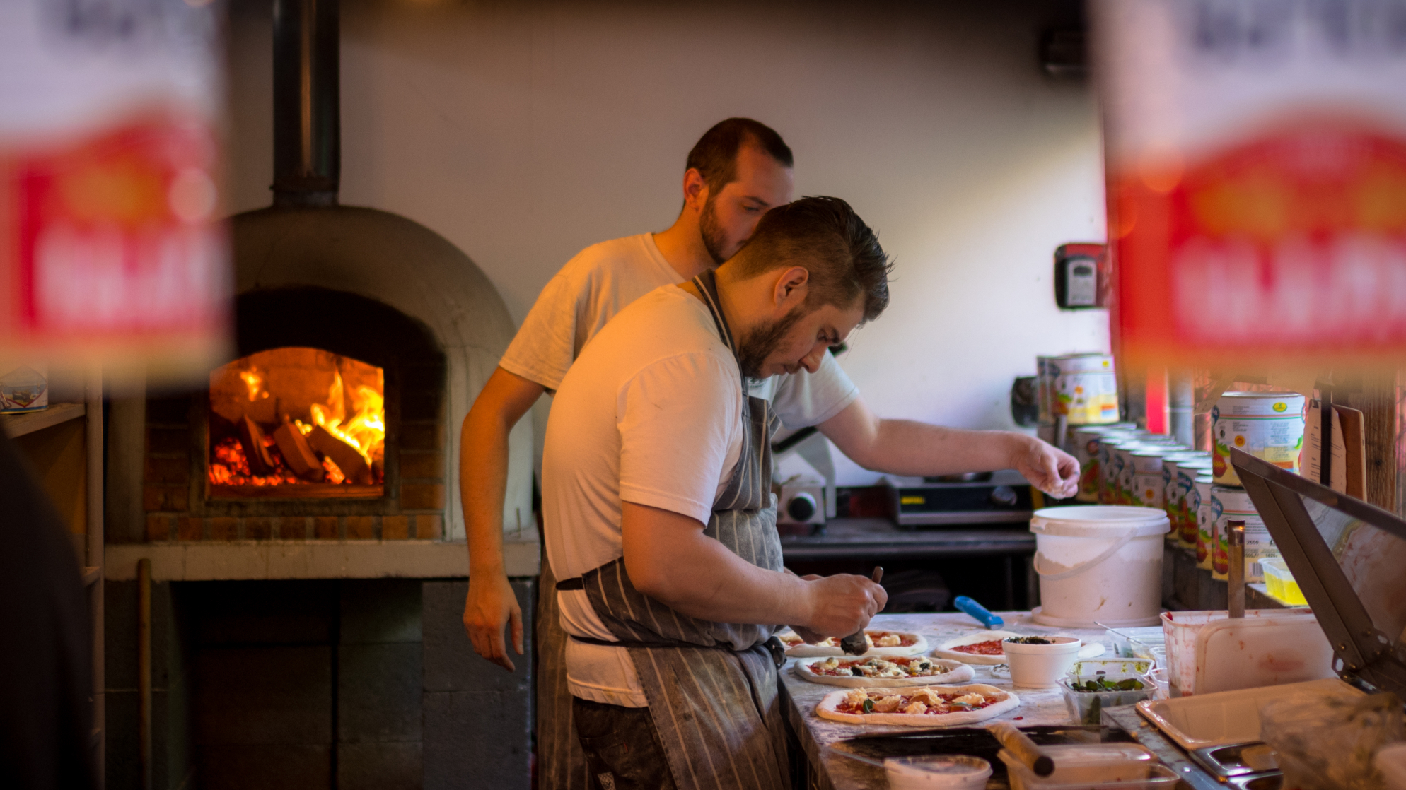 Pizza chef making pizzas at Dusty Knuckle restaurant