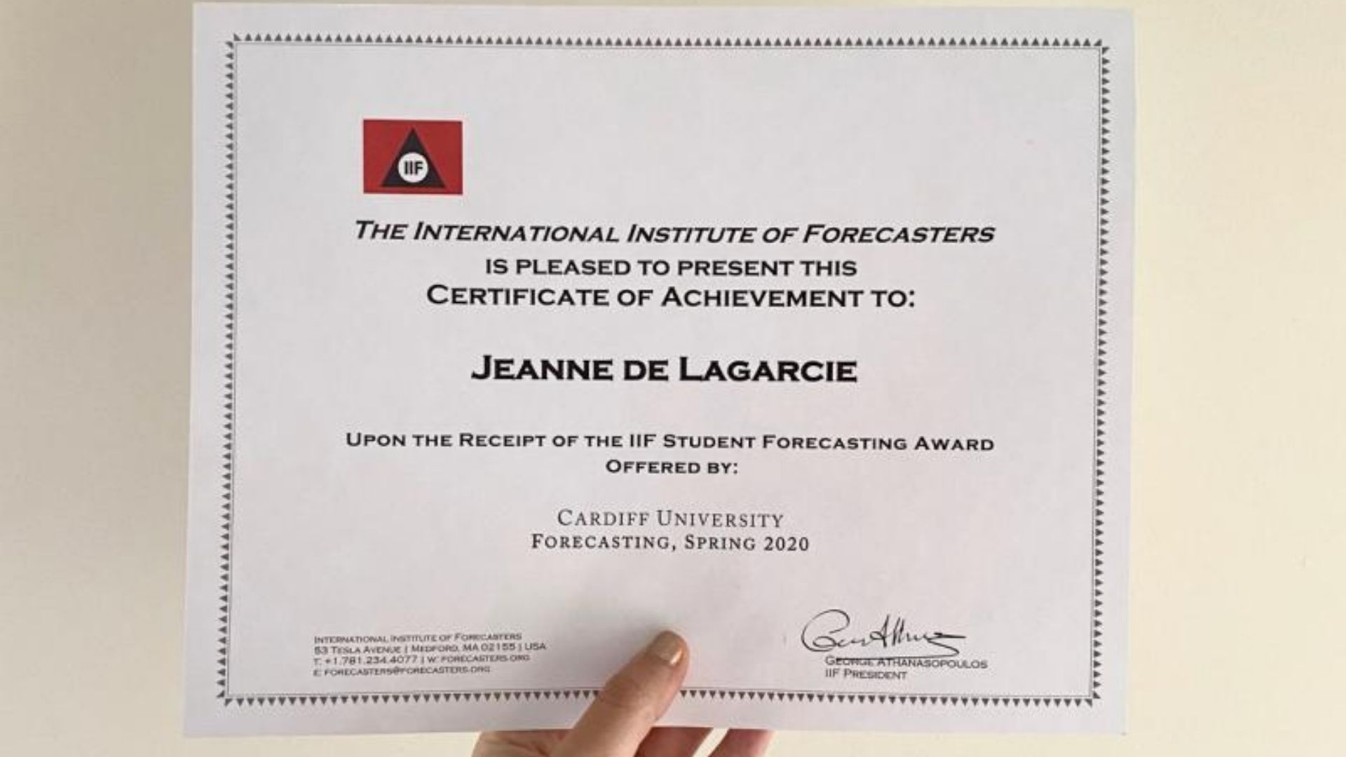 Person holding certificate 