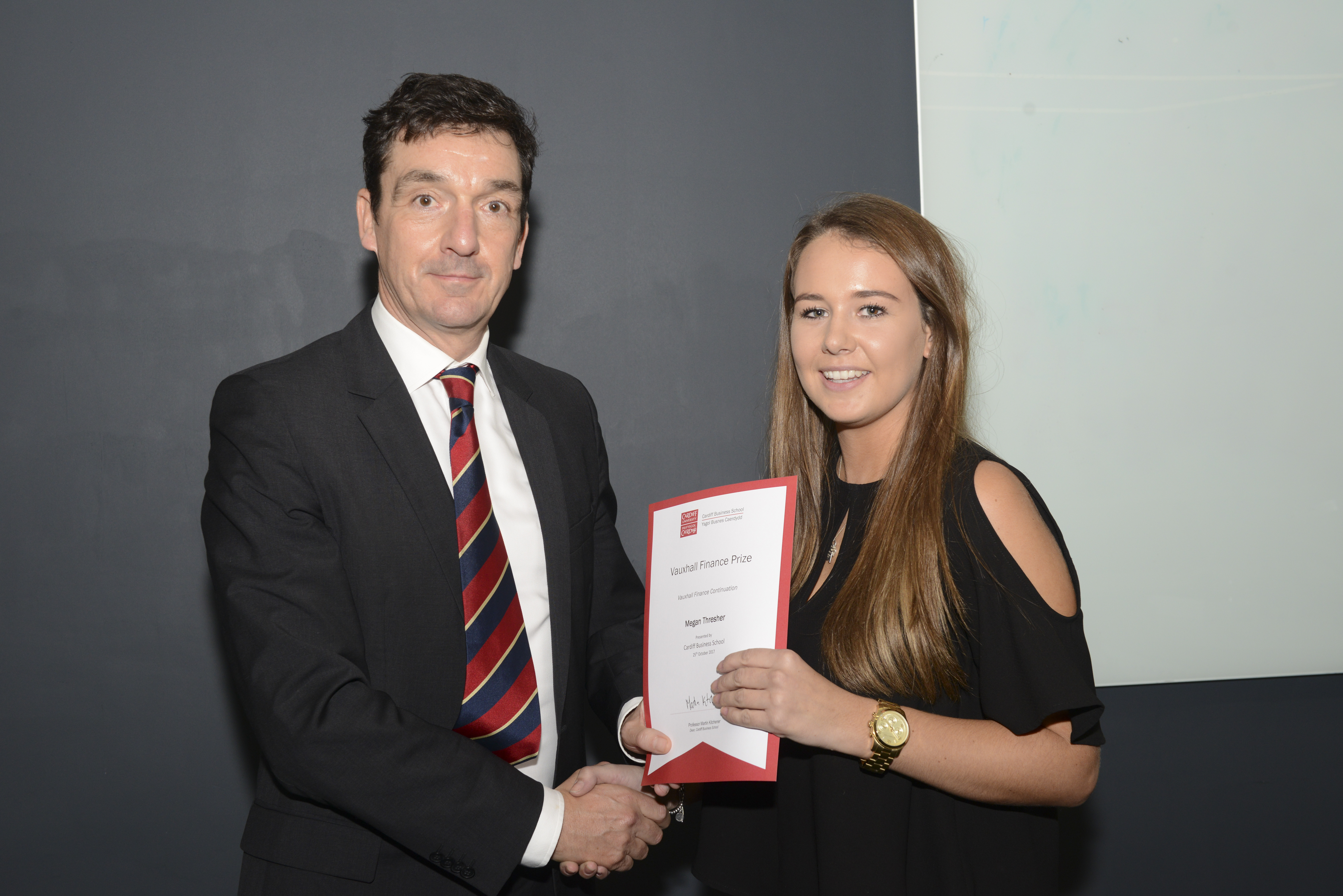 Megan Thresher receiving award from Martin Kitchener