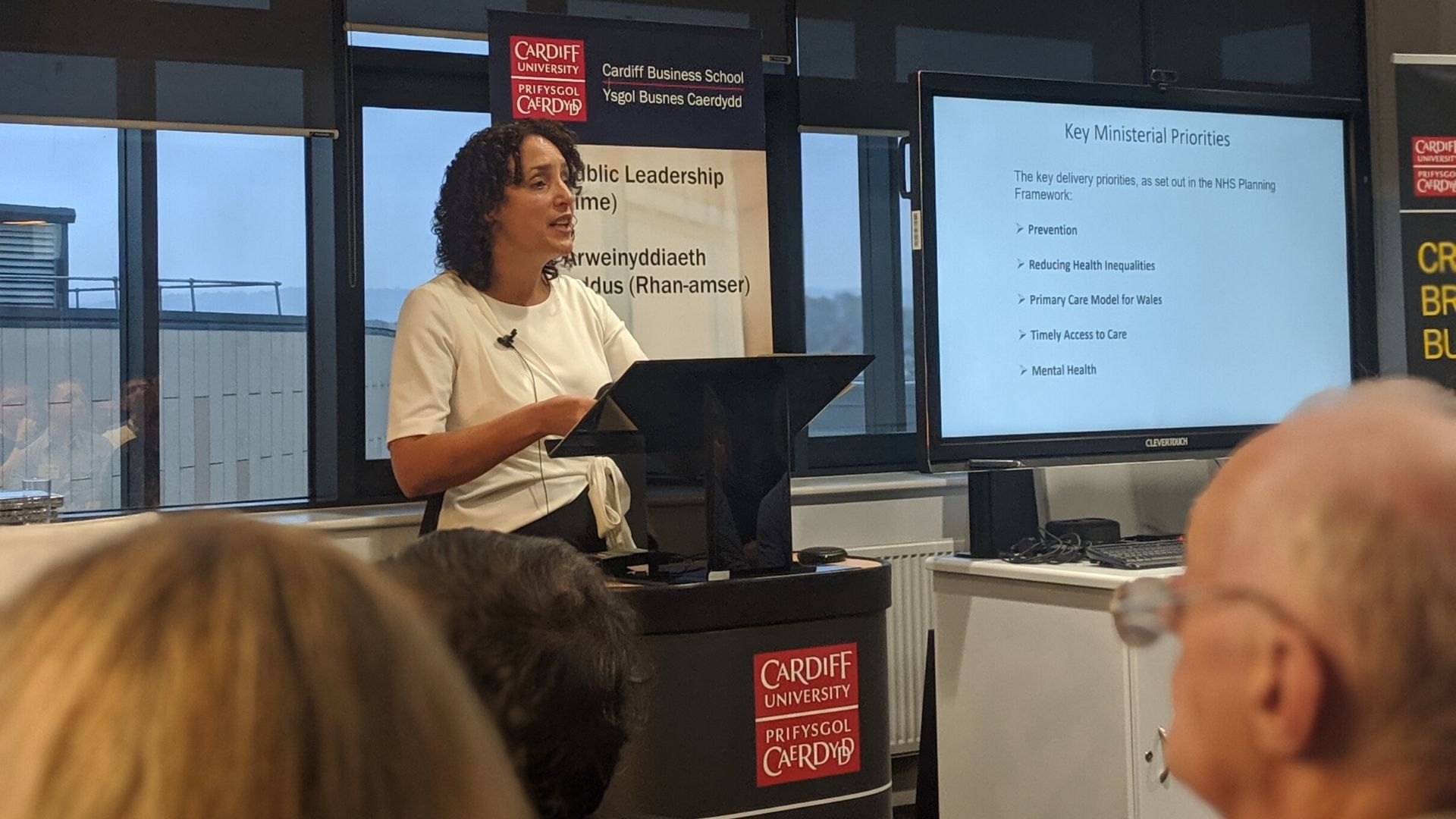 Woman presenting at podium