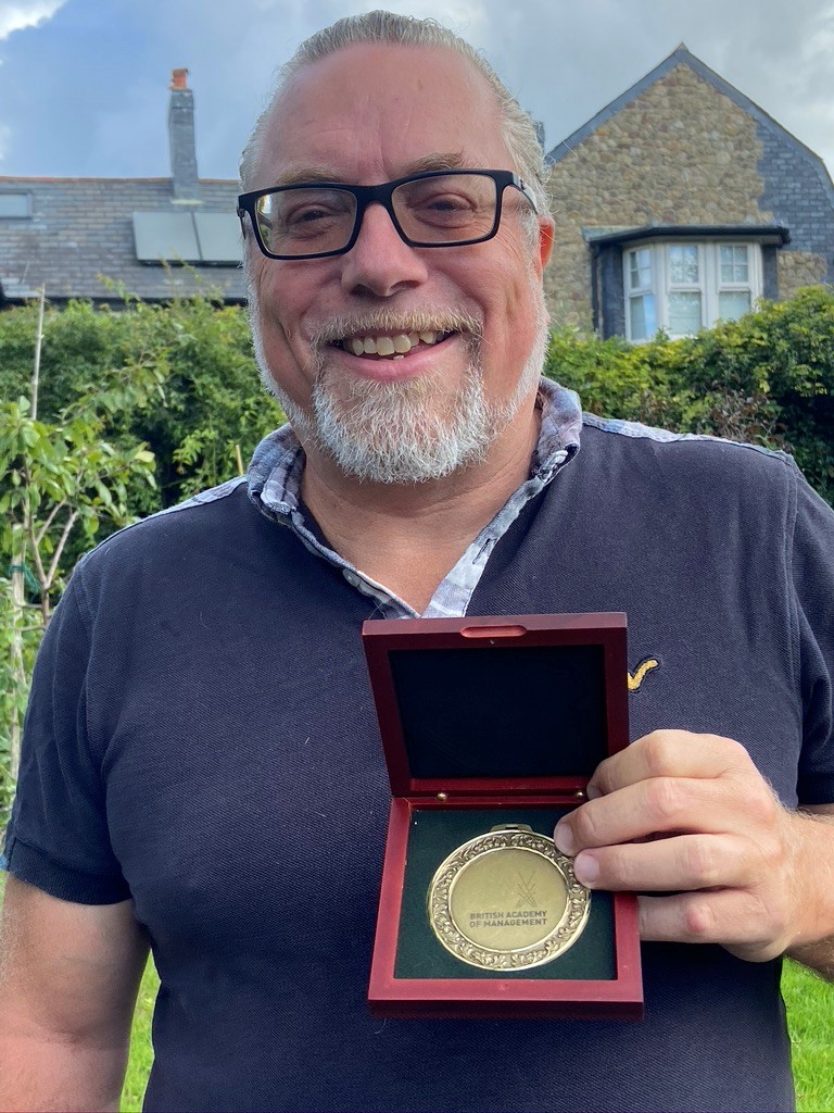 Rick Delbridge with BAM medal for leadership 