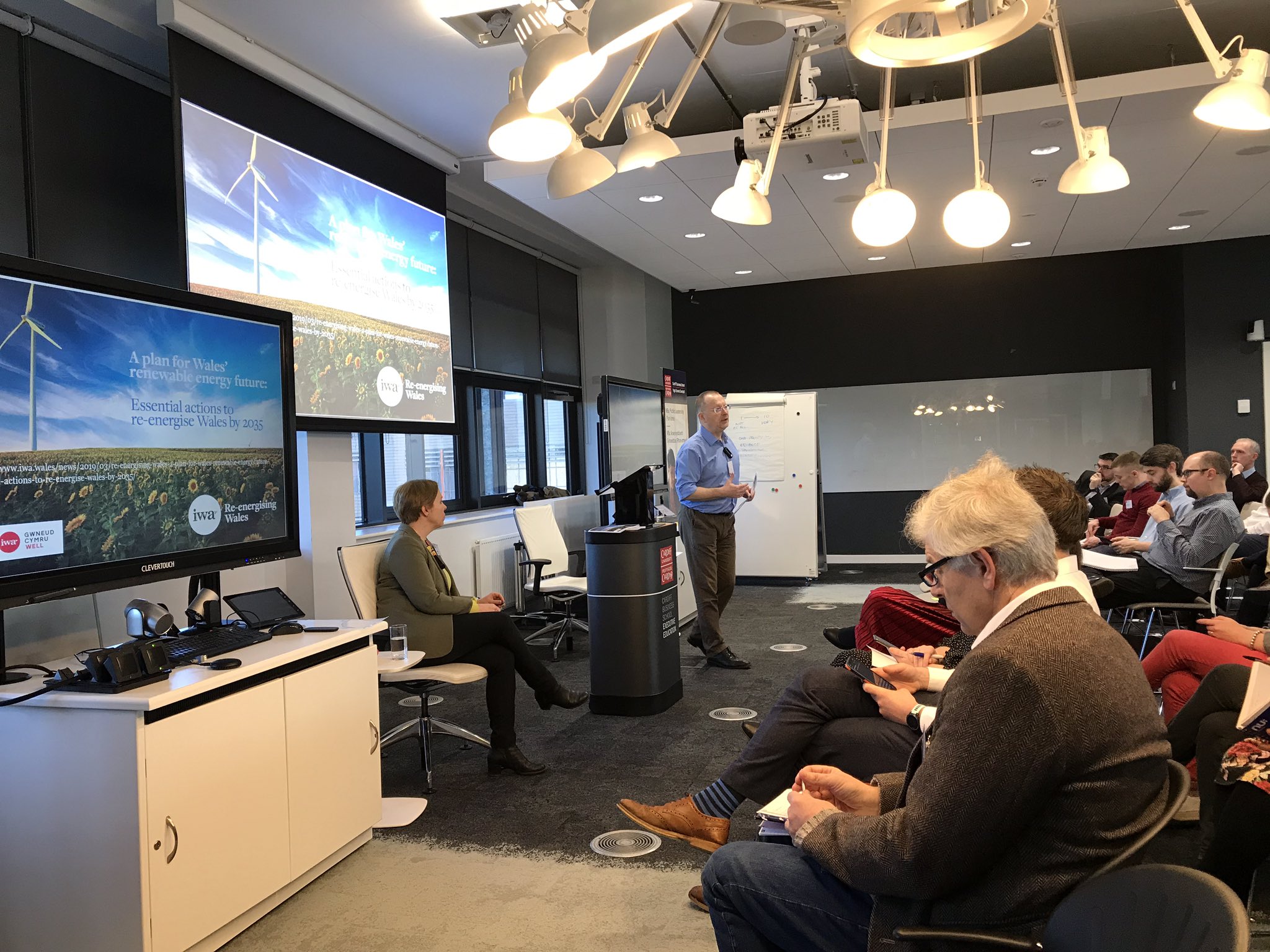 Man presenting in lecture space