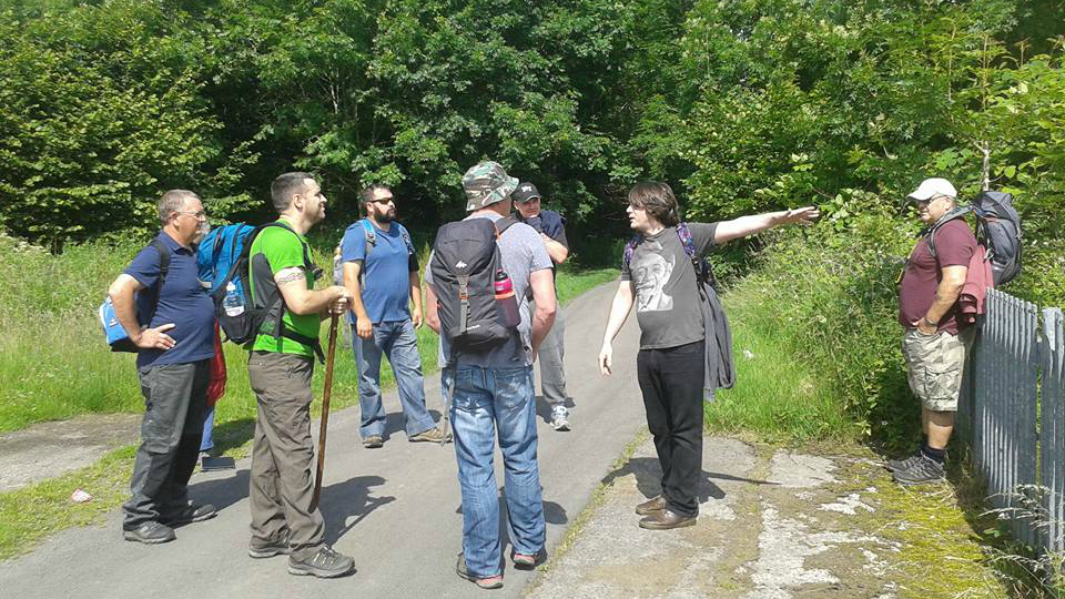 Group of men in woodland area