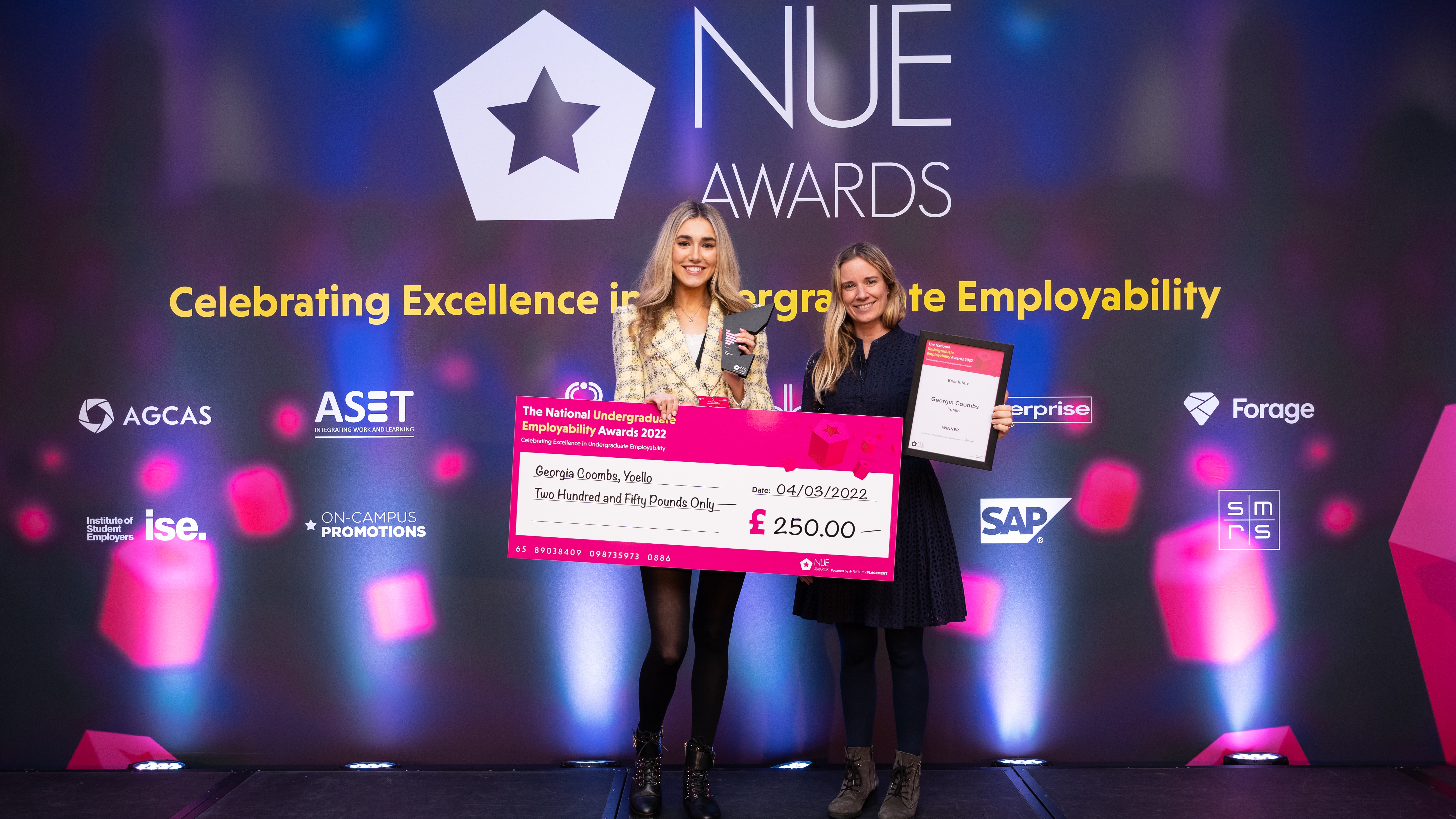 Student Georgia Coombs accepting a cheque for winning an award at National Undergraduate Employability Awards 2022