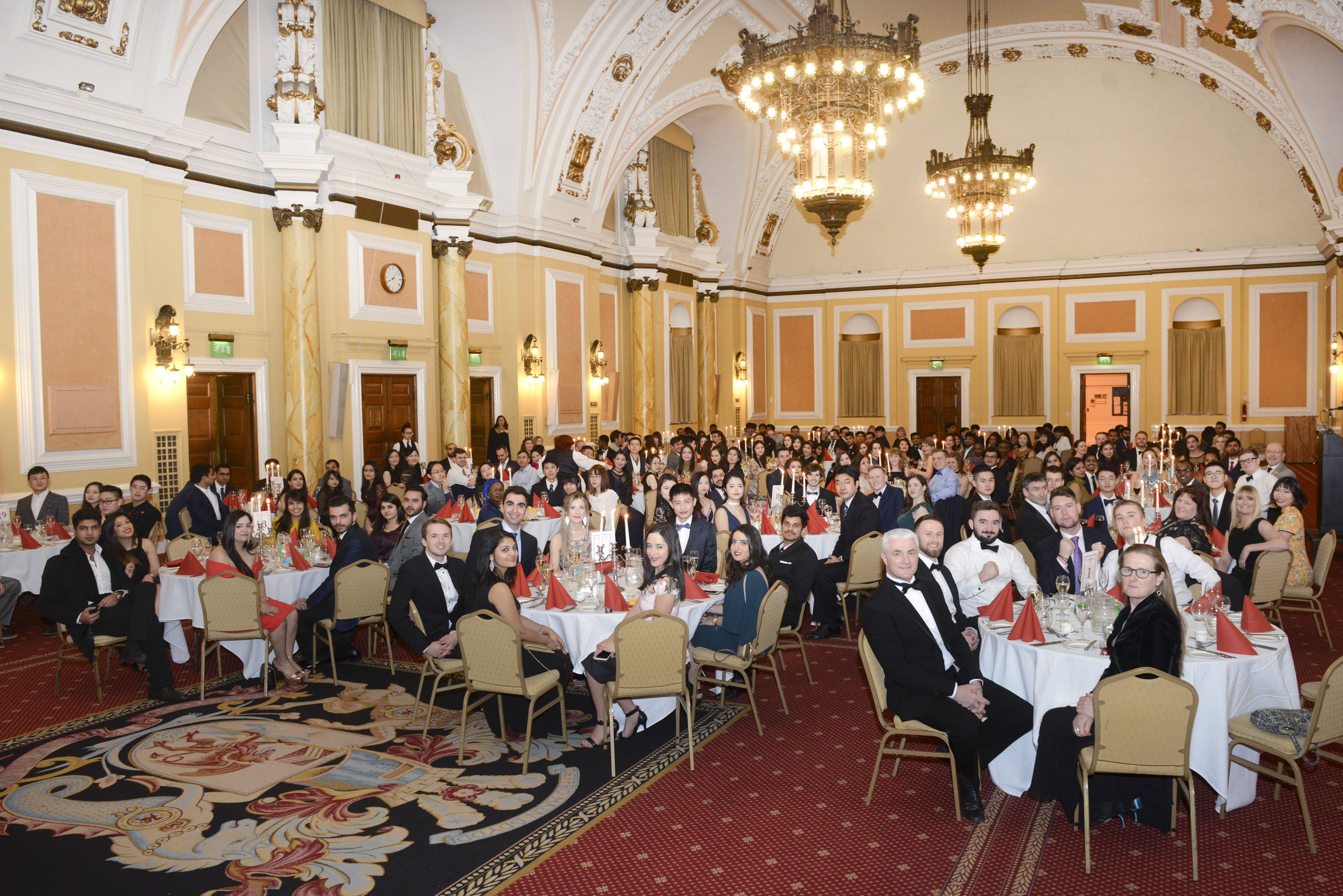 Large audience seated at tables