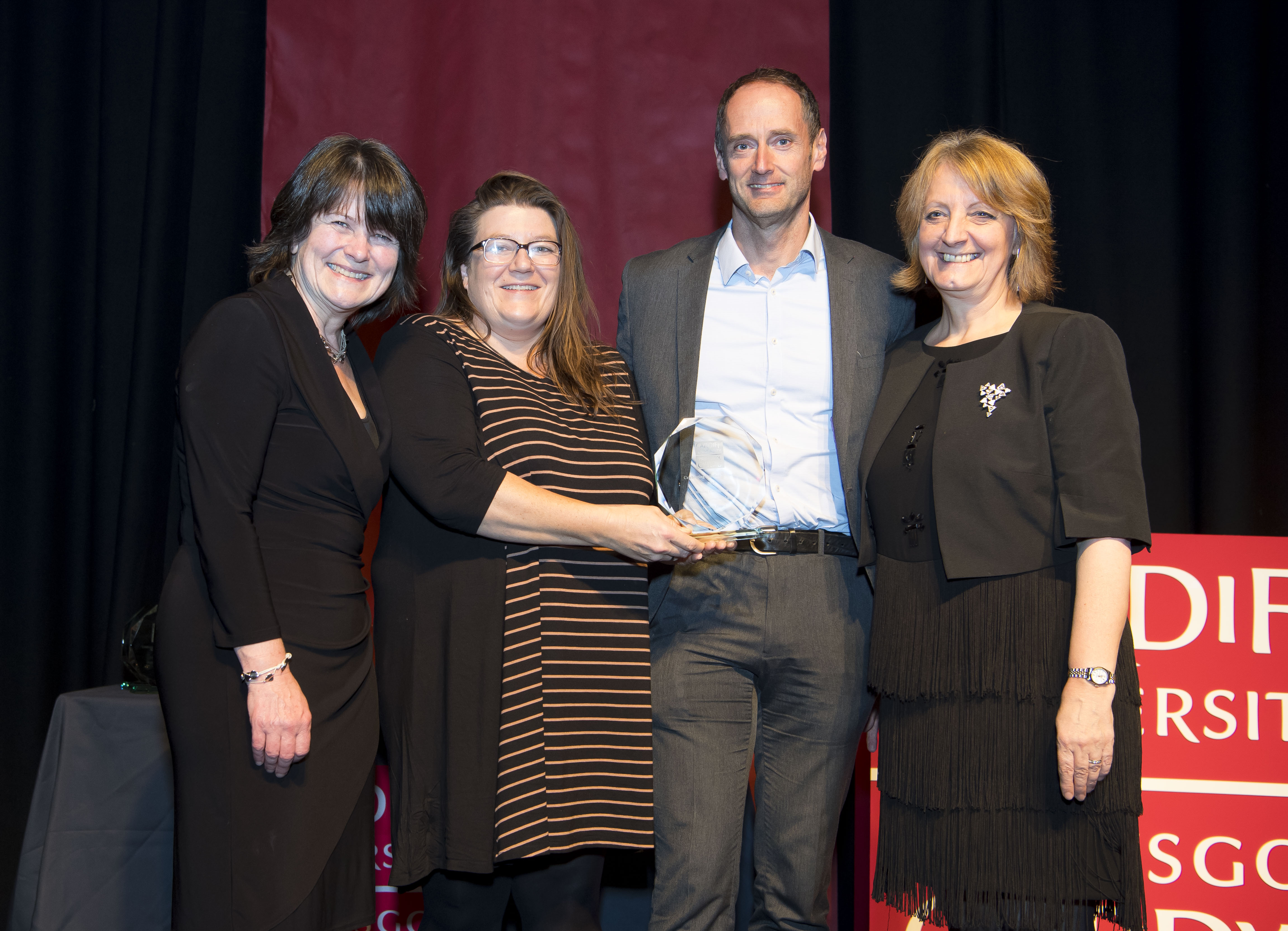 The Phoenix Project team receiving an award