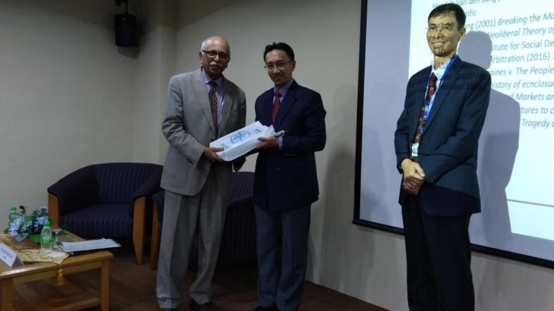 Dr Rawindaran Nair presented with memento